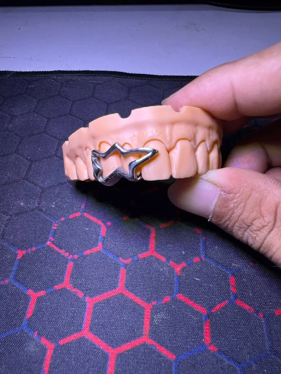 Detailed view of Star design grillz dental jewelry